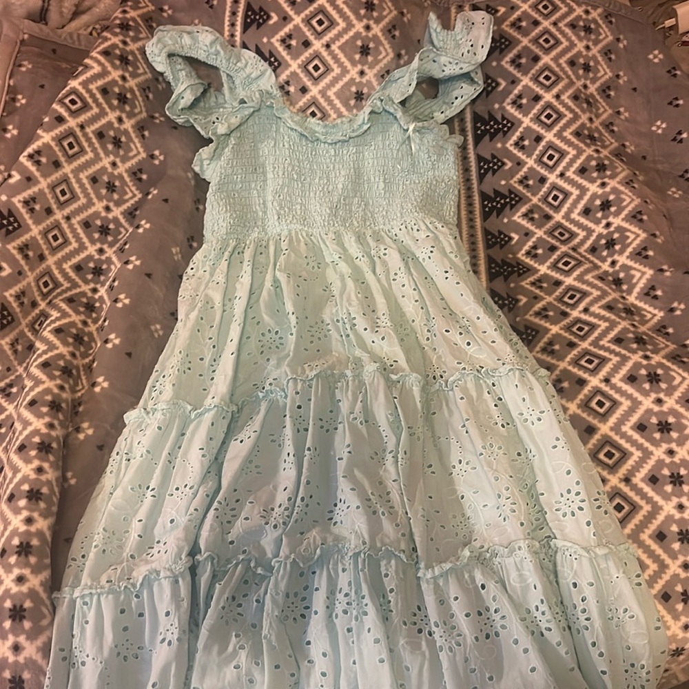 Small, light blue, sleeveless, ankle length crown and ivy dress